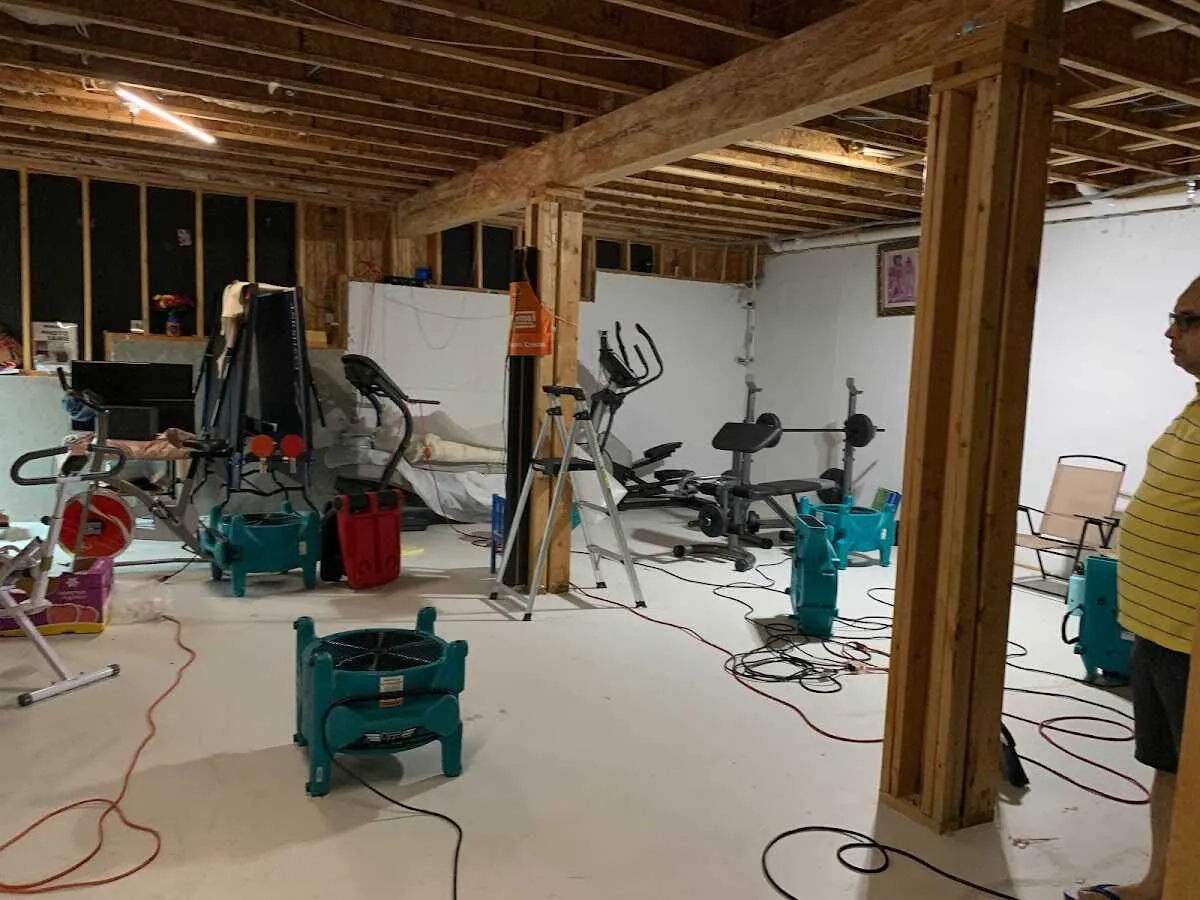 Basement drying equipment setup for Contents Cleaning & Restoration in Smithville